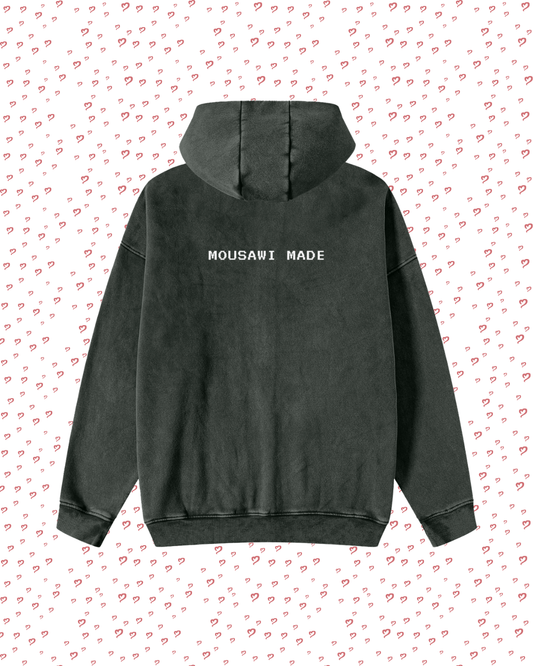 Black hoodie with 'MOUSAWI MADE' text on a white background with red heart patterns