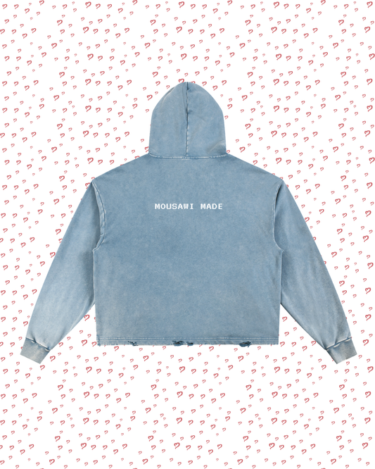 Blue hoodie with 'Mousavi Made' text on a white background with red heart patterns