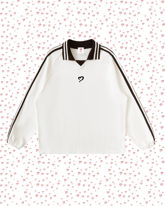 White sports jersey with black accents on a pink heart-patterned background