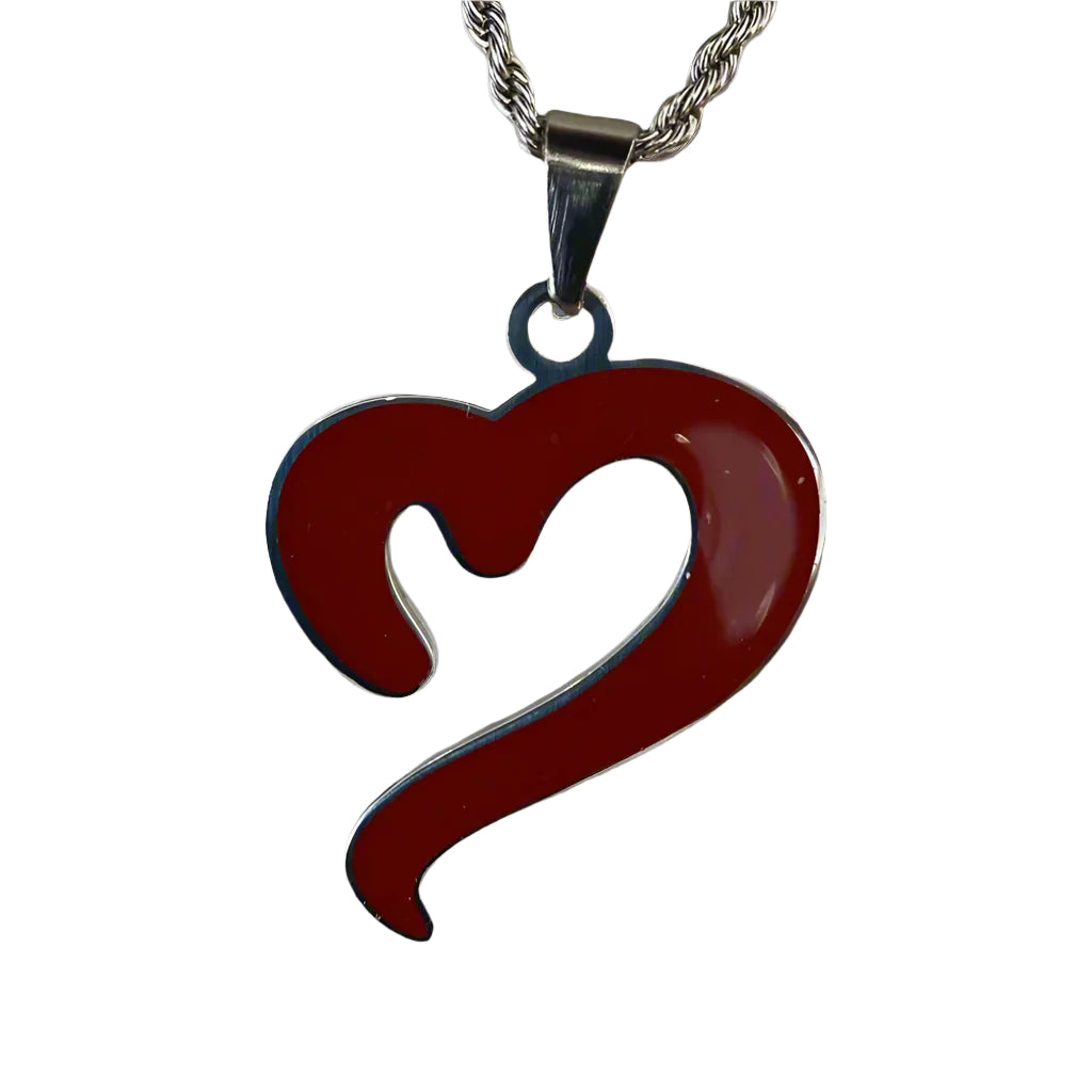 Close-up of the heart pendant on the With Heart silver chain by Mousawi - polished detail shot.